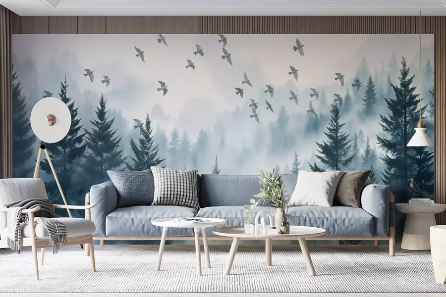 wall murals Мирна магловита шума са дрвећем у нијансама плаве и јатом птица лети на небу w08664